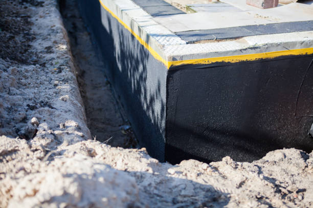 Professional Waterproofing technician working in Mount Holly, NC